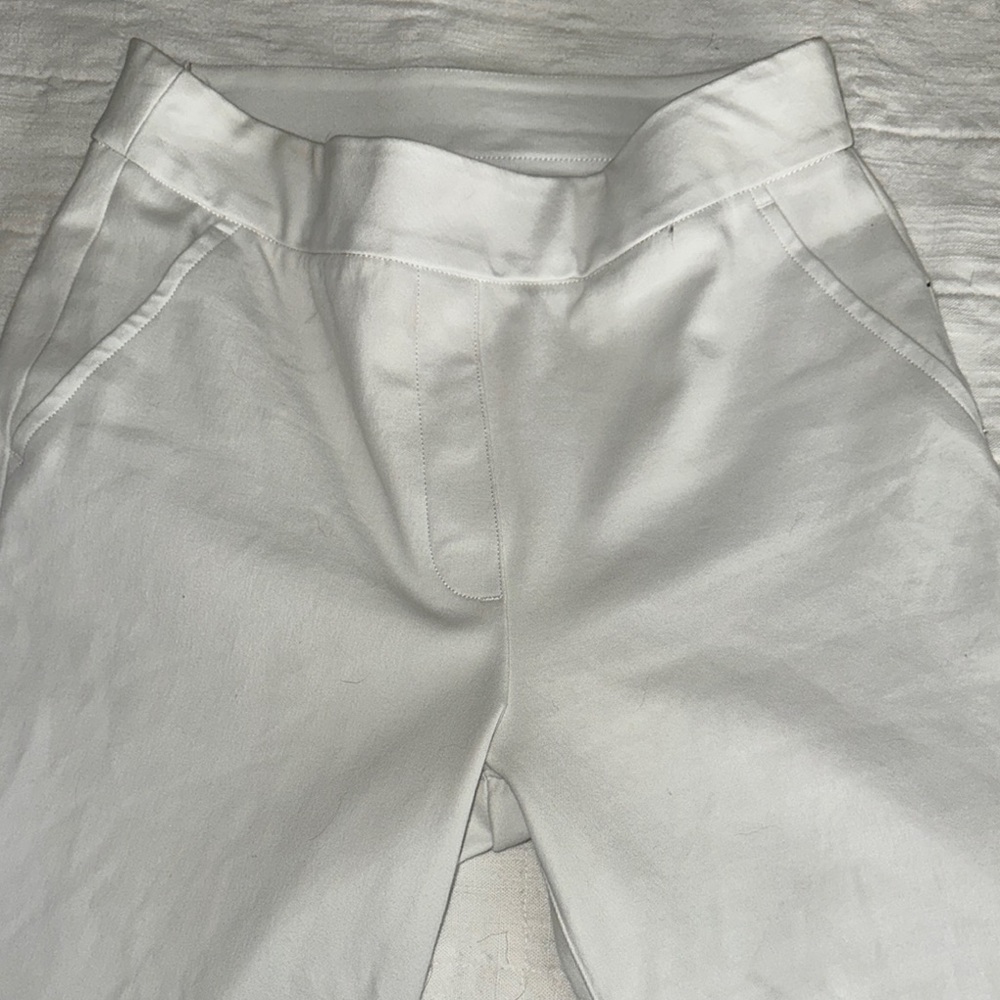 White pants by Spanx. coating on inside to prevent seeing through the white